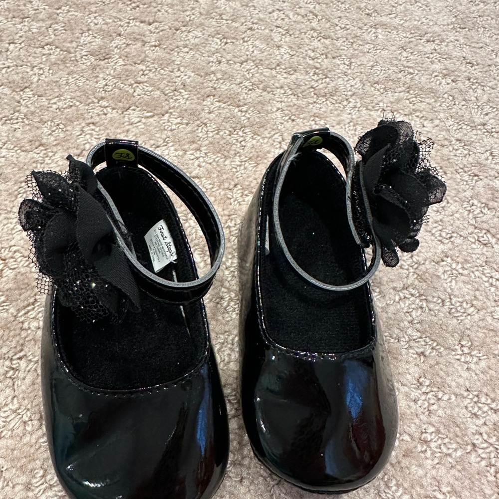 First steps 6-9 months black with faux flower new without tags